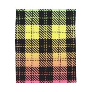 May include: A rectangular fabric with a plaid pattern. The design features a gradient of colors, transitioning from green to yellow, then orange, and finally pink. Black lines create the plaid grid.