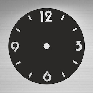 May include: A black clock face with white numerals at 12, 3, 6, and 9 o'clock. The clock face has small white dashes marking the other minute intervals. The background is a white brick wall.