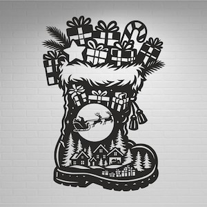 May include: Black Christmas boot silhouette filled with gifts, a candy cane, and a star. Inside the boot, a winter scene with houses, trees, and Santa's sleigh is visible. The boot has a fluffy white trim.