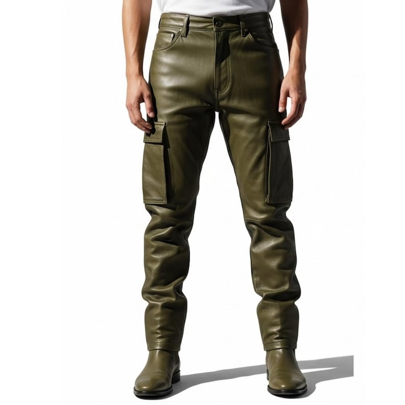 May include: Olive green leather cargo pants with two large pockets on the thighs. The pants have a classic five-pocket design and are paired with matching olive green boots. The pants are made of a smooth, shiny leather material.