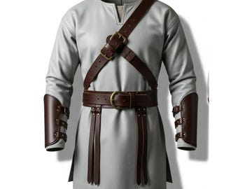 May include: A light gray tunic with long sleeves, a V-neck, and a brown leather belt and shoulder strap. The outfit includes matching brown leather arm guards with buckle details. This medieval-style garment is suitable for cosplay or historical reenactments.