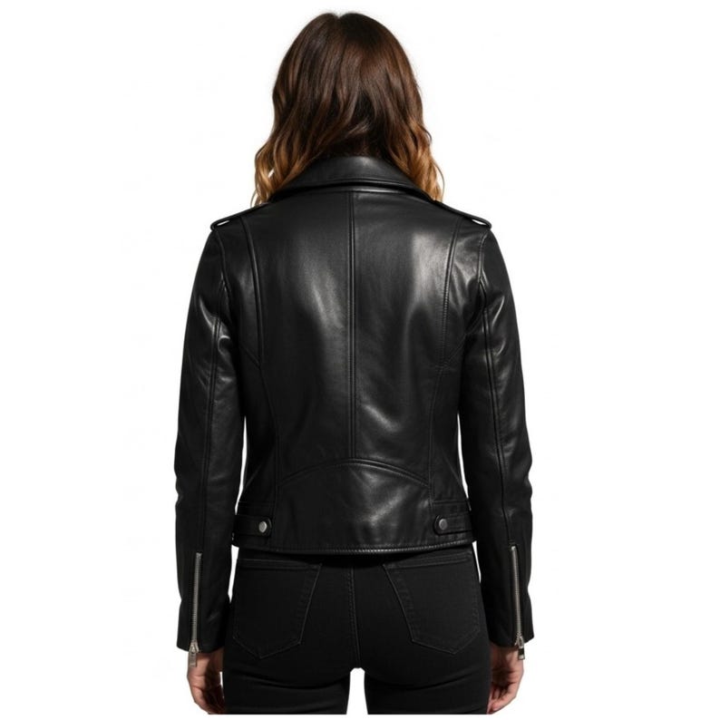 May include: Black leather jacket with a classic biker style. Features include a notched collar, asymmetrical zipper closure, and zippered cuffs. The jacket has a tailored fit and visible stitching details.