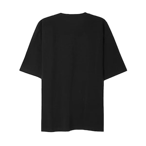 May include: A solid black, short-sleeved t-shirt. The shirt has a relaxed fit with a crew neck and short sleeves. The fabric appears to be a soft, opaque material. The shirt is a versatile basic.