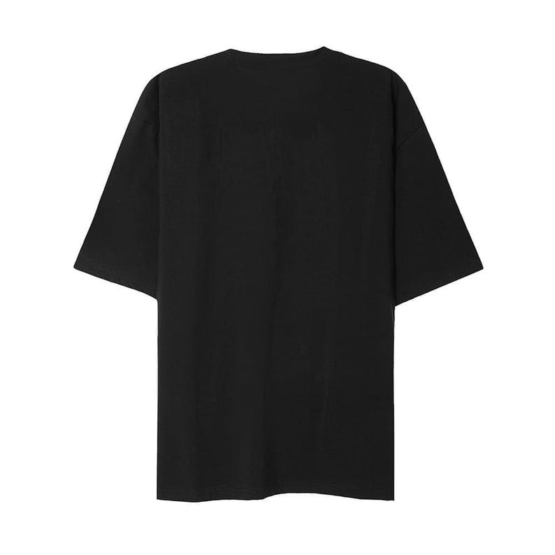 May include: A solid black, short-sleeved t-shirt. The shirt has a relaxed fit with a crew neck and short sleeves. The fabric appears to be a soft, opaque material. The shirt is a versatile basic.
