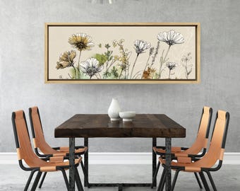 May include: A dining room scene featuring a rectangular wooden table and four chairs with tan leather seats and black metal frames. Above the table hangs a framed floral artwork with a beige background and a variety of flowers.