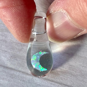 Petite moon opal pendant encased in clear borosilicate glass.  Pendant is handmade with love by The Flowing Crystall.