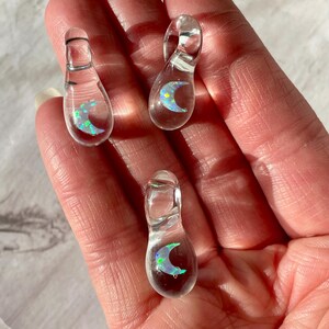 Petite moon opal pendant encased in clear borosilicate glass.  Pendant is handmade with love by The Flowing Crystall.