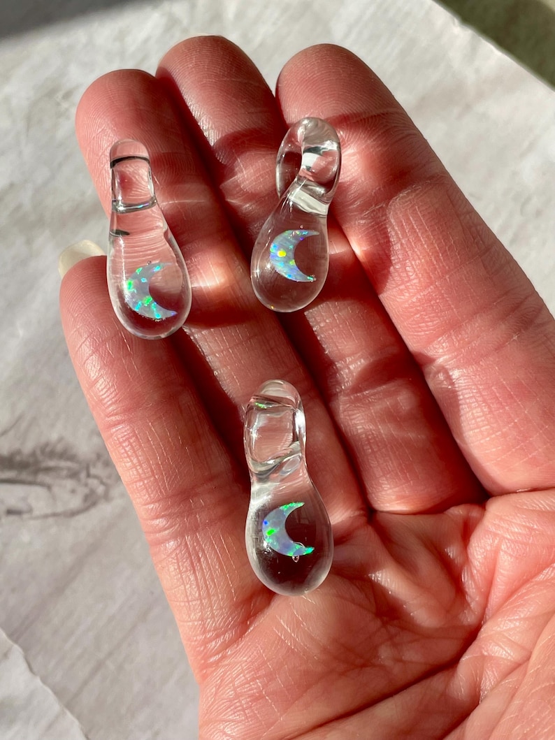 Petite moon opal pendant encased in clear borosilicate glass.  Pendant is handmade with love by The Flowing Crystall.