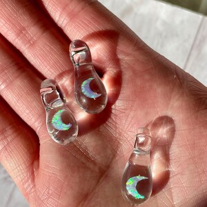 Petite moon opal pendant encased in clear borosilicate glass.  Pendant is handmade with love by The Flowing Crystall.