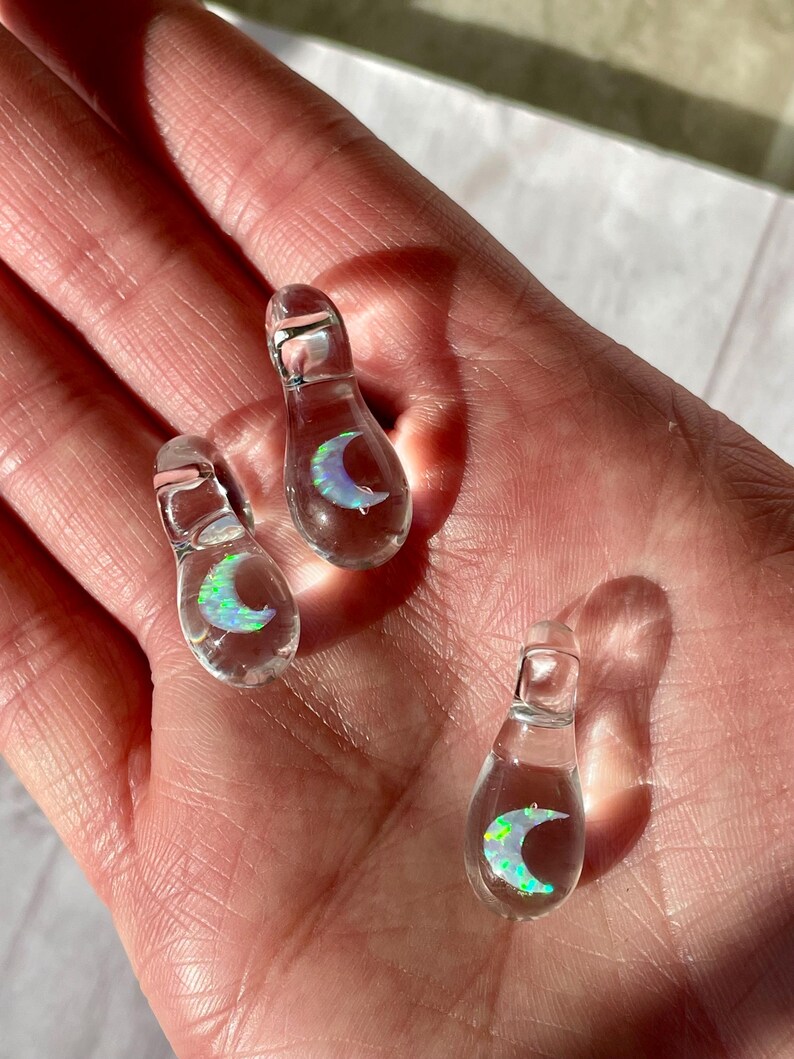 Petite moon opal pendant encased in clear borosilicate glass.  Pendant is handmade with love by The Flowing Crystall.