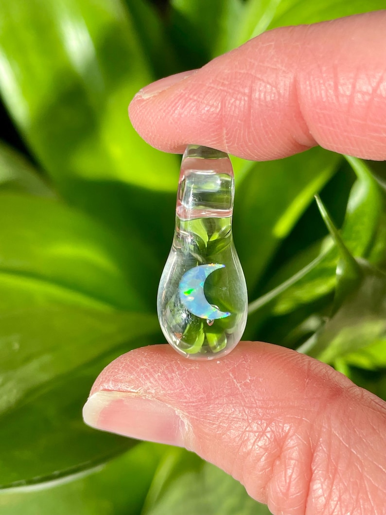 Petite moon opal pendant encased in clear borosilicate glass.  Pendant is handmade with love by The Flowing Crystall.