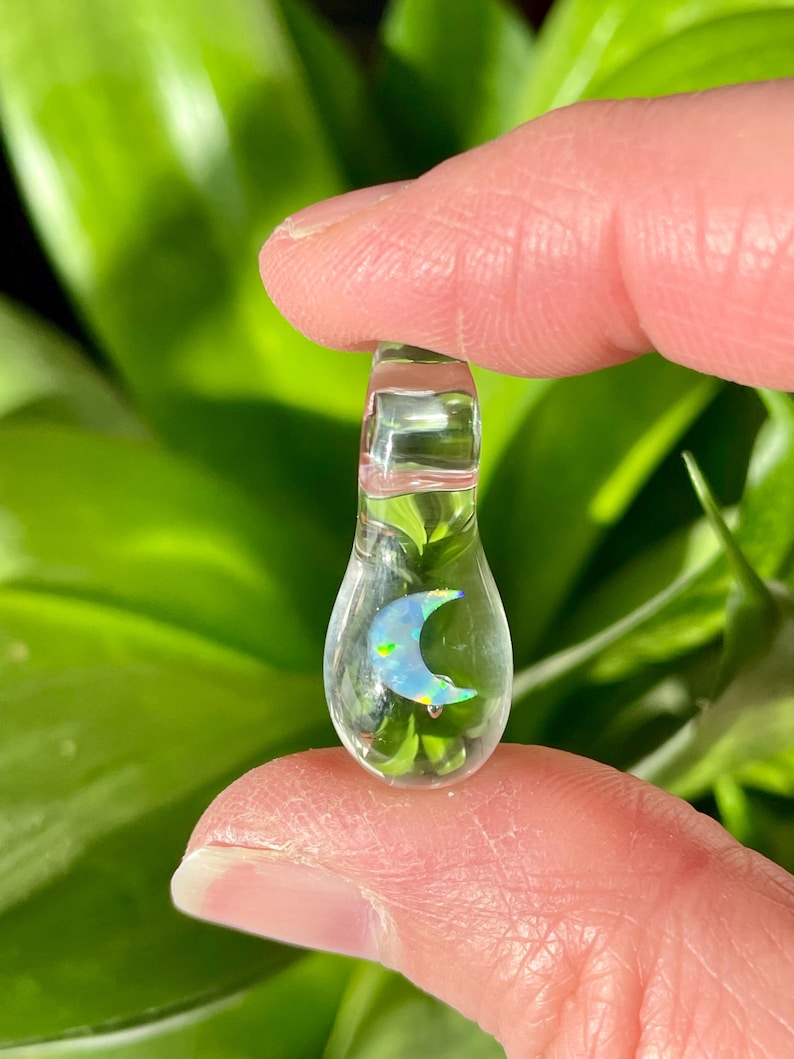 Petite moon opal pendant encased in clear borosilicate glass.  Pendant is handmade with love by The Flowing Crystall.