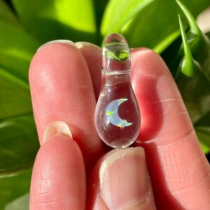 Petite moon opal pendant encased in clear borosilicate glass.  Pendant is handmade with love by The Flowing Crystall.