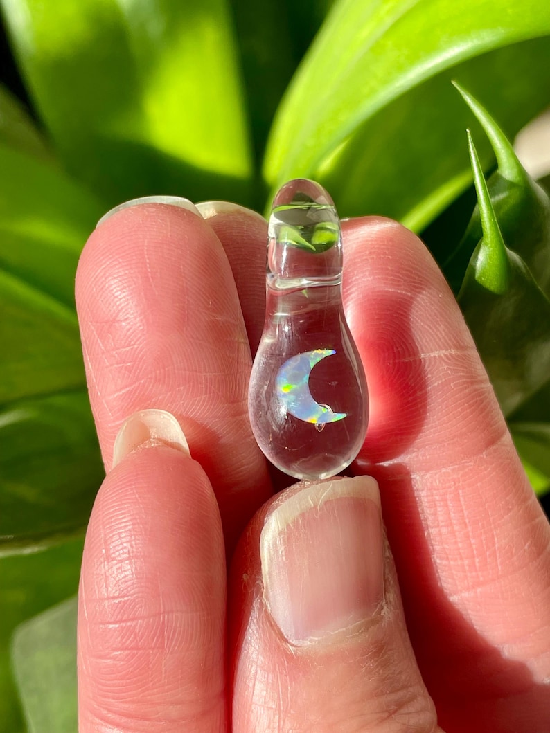 Petite moon opal pendant encased in clear borosilicate glass.  Pendant is handmade with love by The Flowing Crystall.