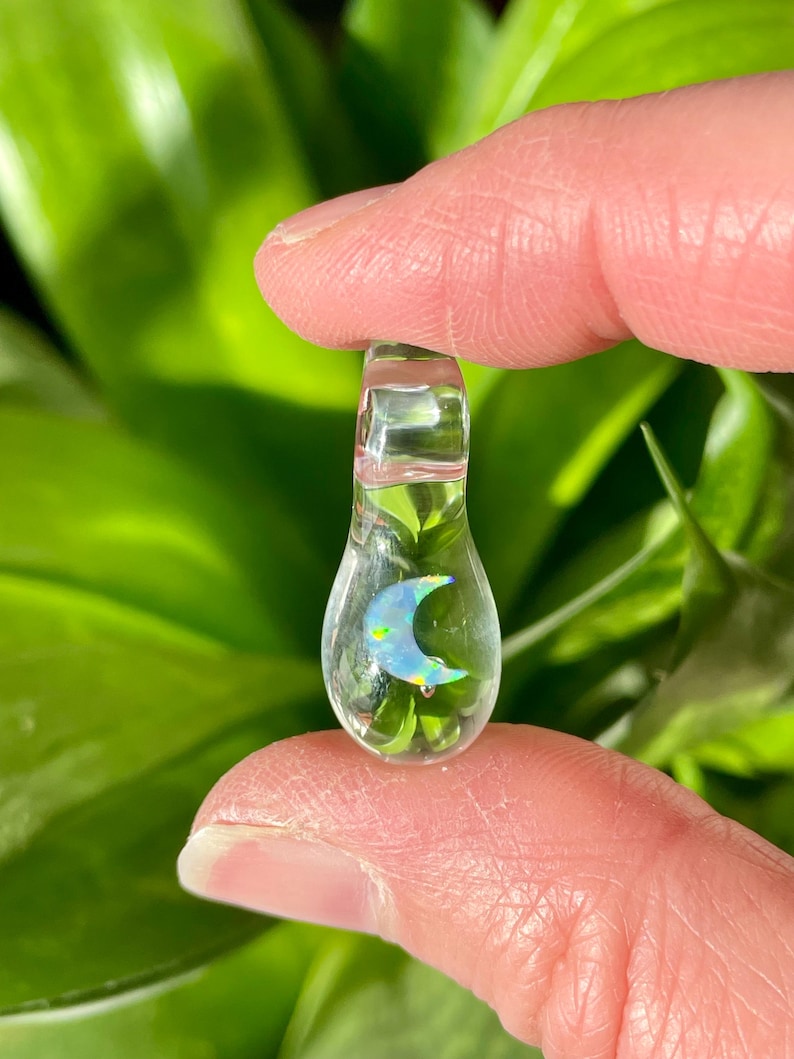 Petite moon opal pendant encased in clear borosilicate glass.  Pendant is handmade with love by The Flowing Crystall.