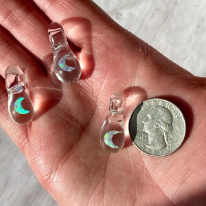 Petite moon opal pendant encased in clear borosilicate glass.  Pendant is handmade with love by The Flowing Crystall.