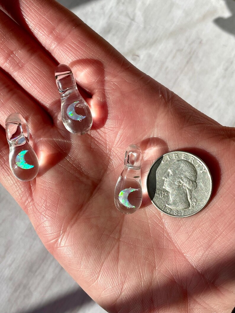 Petite moon opal pendant encased in clear borosilicate glass.  Pendant is handmade with love by The Flowing Crystall.