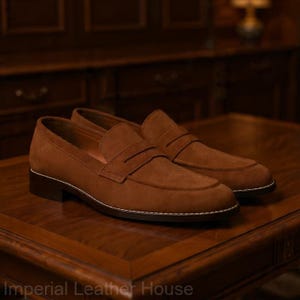 Handmade men’s suede loafers by Imperial Leather House featuring classic penny slip-on design, luxury