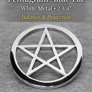 May include: A white metal Pentagram Altar Tile, 2 3/4 inches in diameter, with the words "Balance & Protection". The pentagram is a five-pointed star within a circle. The tile is circular and sits on a gray surface.
