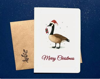 Tarjeta navideña de Canada Goose: Ganso con gorro de Papá Noel, saludo navideño, tamaño A6 minimalista, sobre kraft.