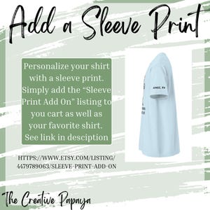 May include: Light blue t-shirt with a sleeve print. The text on the sleeve reads "AIMEE, RN". The image also includes the text "Add a Sleeve Print" and instructions on how to personalize a shirt with a sleeve print.