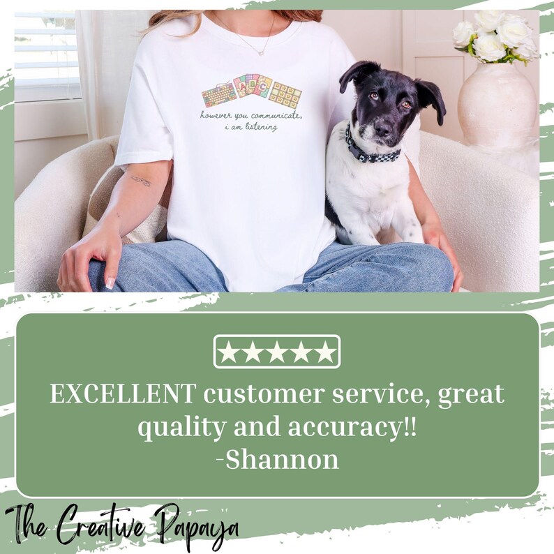 May include: White t-shirt with the text "however you communicate, I am listening" and a keyboard graphic. A black and white dog is sitting on a person's lap. The Creative Papaya logo is at the bottom.