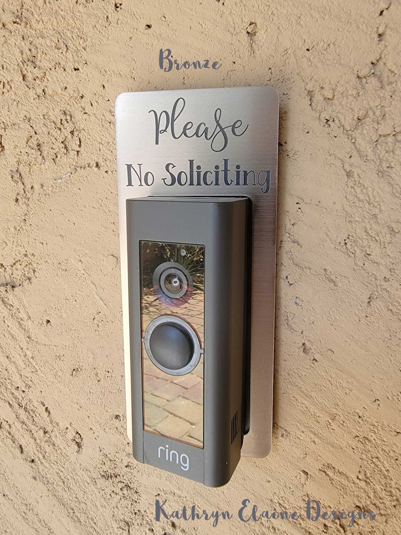 Ring doorbell with bronze and gray No Soliciting Sign