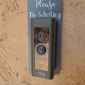 Ring doorbell with gray and white No Soliciting Sign