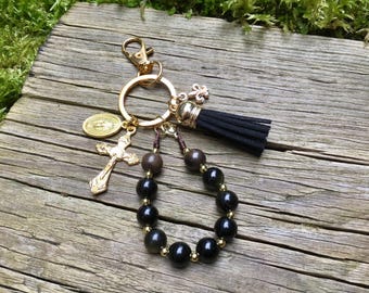Rosario de obsidiana con flor de lis del Guerrero de la Oración