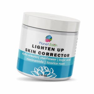 May include: A white plastic jar of Planet Eden Lighten Up Skin Corrector with a white lid. The label features a blue band, a lotus flower graphic, and text listing ingredients including alpha arbutin, starflower, kojic acid, niacinamide, and licorice root. 2 fl oz.