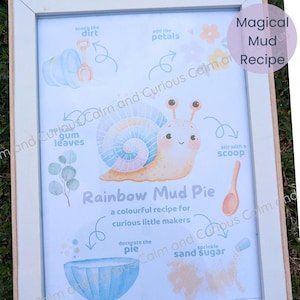 May include: A framed print titled Magical Mud Recipe featuring a pastel snail with a rainbow shell. The illustration includes instructions for a Rainbow Mud Pie, showing a blue bowl, a wooden spoon, gum leaves, and text for curious little makers.