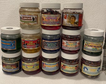 May include: A collection of glass jars with white lids, filled with various substances. Each jar has a label with text and images. The jars are arranged in rows, showcasing a variety of products.