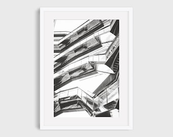 May include: Black and white architectural print of a modern building with geometric shapes and reflective surfaces. The print is framed in a white border. The text at the top says, "Frame and mat for example only. This listing is for an unframed In This Instance Photography print."