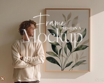Maqueta PSD minimalista de marco de pared / Interior bohemio neutro con hombre