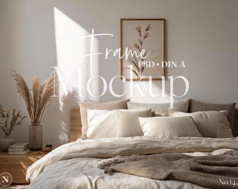 May include: A bedroom scene featuring a bed with multiple pillows and a neutral-toned comforter. A framed botanical print hangs above the bed. The text "Frame Mockup" is overlaid on the image. Dried plants in a vase add a natural touch.