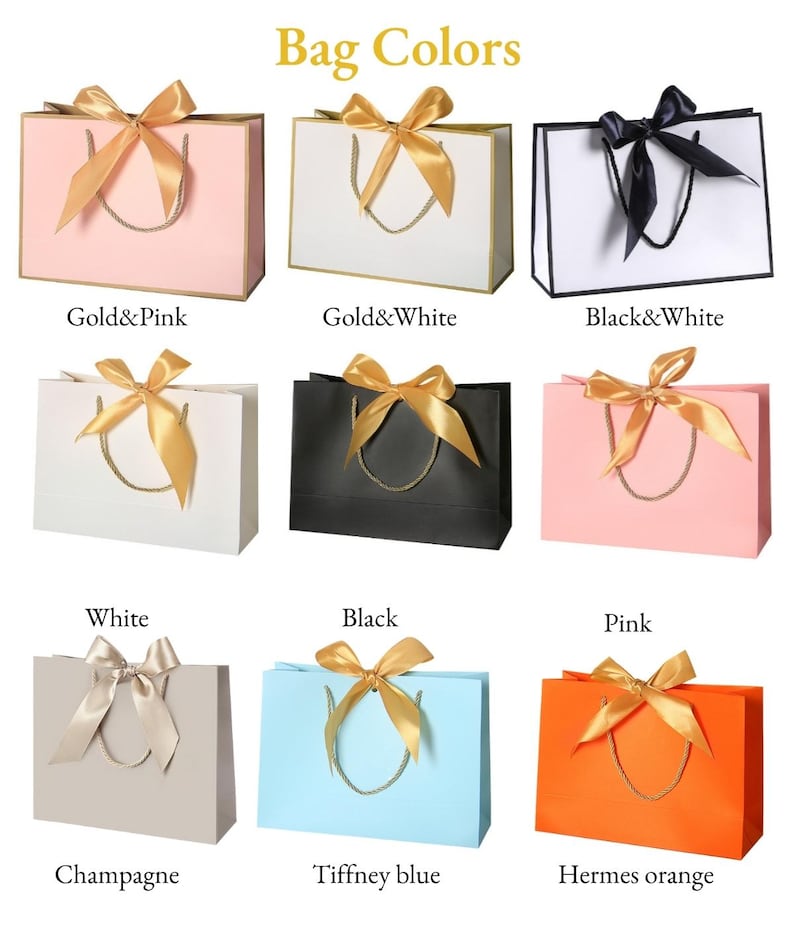 May include: Nine gift bags in various colors, each with a matching ribbon bow and rope handles. Colors include pink, white, black, champagne, Tiffany blue, and Hermes orange. Text on the image reads "Bag Colors."
