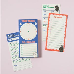 May include: A collection of colorful sticky notes for planning and organization. Includes a blue Time Table and To-Do List, an orange To-Do List, and a green Monthly Habit Tracker. Each note features a unique design with text and illustrations.