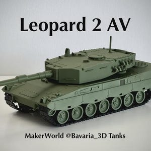 May include: An olive green scale model of a Leopard 2 AV tank featuring a long main gun, a rotating turret, and black tracks. The text Leopard 2 AV is printed above the tank, and MakerWorld @Bavaria_3D Tanks is printed below the tank.