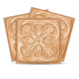 May include: Four square, light brown tiles are stacked, each featuring a carved floral design. The design includes a central circle with radiating petals and stylized flowers. The tiles have a textured appearance.