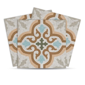 May include: Four square tiles with a repeating floral pattern. The design features a central cross shape in green, surrounded by light blue, brown, and tan curved elements, all set against a light gray background. The tiles are arranged in a slightly overlapping manner.