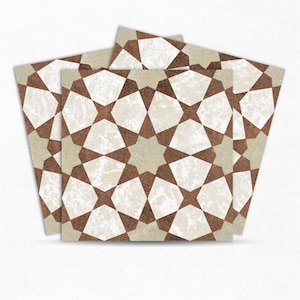 May include: A stack of square tiles with a repeating geometric pattern. The design features a star-like motif in shades of brown and white against a beige background. The tiles have a slightly distressed, textured appearance.