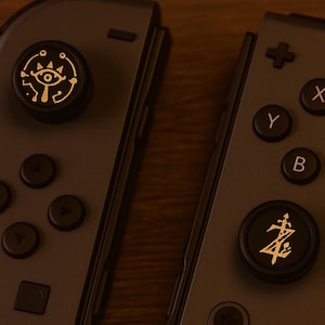 Zelda Eye Switch Thumb Grip Caps – Black and Yellow Joystick Covers, Silicone Protective Rocker Caps for Switch OLED and Lite