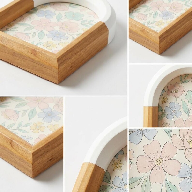May include: A decorative tray with a floral pattern. The tray has a wooden frame with a white arched top and a light floral design in the center. The tray's corners are made of wood.