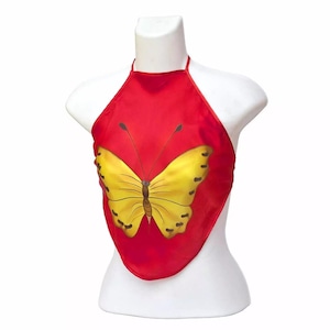 May include: Red halter top with a yellow butterfly design. The top is made of a silky material.