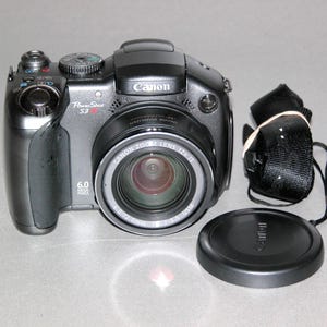 Reconditioned - Canon PowerShot S3 IS 6.0MP Digital Camera #0465 (Use 4 AA Batteries)