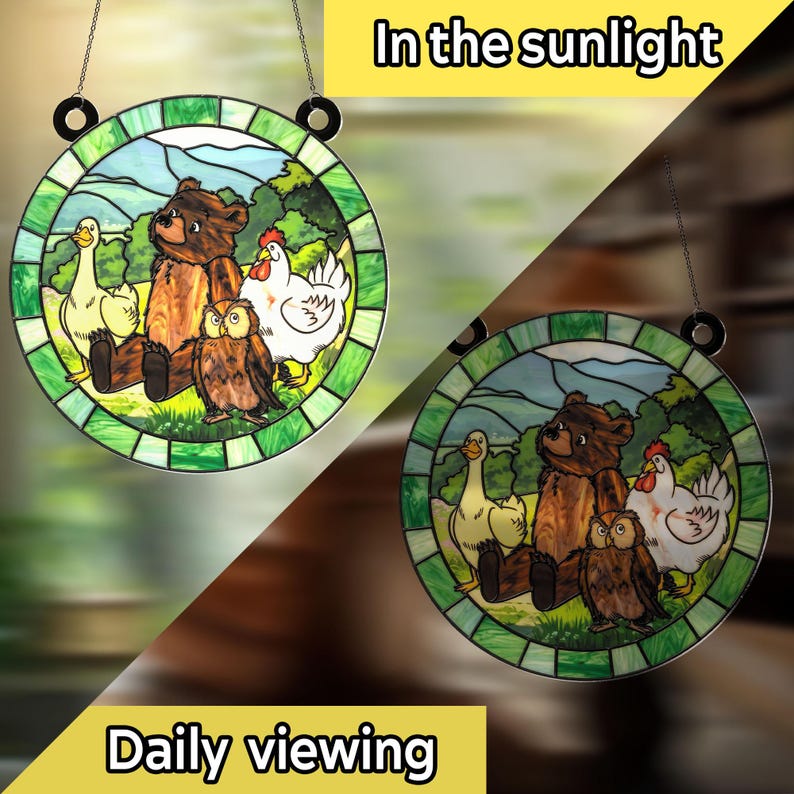 May include: Round stained glass window art featuring a bear, owl, duck, and chicken in a pastoral scene. The artwork is framed with a green border and includes the text "In the sunlight" and "Daily viewing".