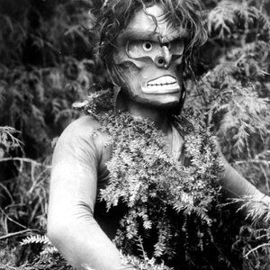 Dancer representing Paqusilahl, wild man of the woods.