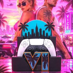May include: A black and white game controller resting in a black stand featuring a blue circular graphic of a city skyline with palm trees and the Roman numeral VI. The stand has a blue and orange palm tree design on the front base.
