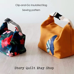May include: Two insulated lunch bags, one with a tropical floral print and the other a solid mustard yellow with a blue and white geometric design. Both bags have a black clip-on handle and are made from fabric. The text "Clip-and-Go Insulated Bag Sewing pattern" is at the top of the image and "Story Quilt Etsy Shop" is at the bottom.