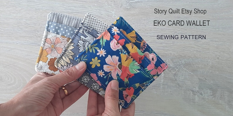 May include: Three colorful fabric card wallets with floral patterns. The wallets are folded and held in a hand. The text "Story Quilt Etsy Shop" and "EKO CARD WALLET SEWING PATTERN" is visible in the background.